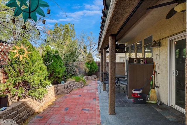 view of patio / terrace featuring ceiling fan