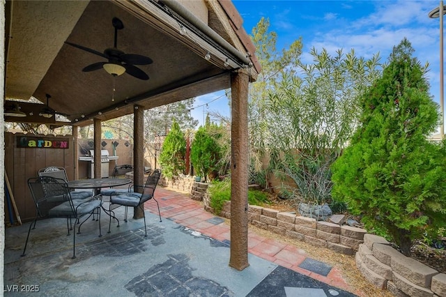 view of patio featuring ceiling fan