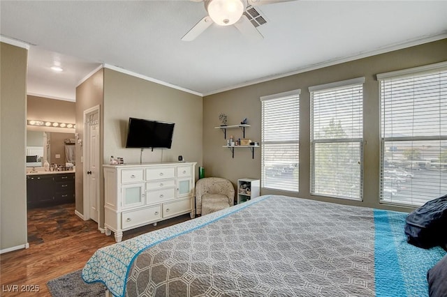 bedroom featuring ensuite bathroom, crown molding, dark hardwood / wood-style floors, and ceiling fan