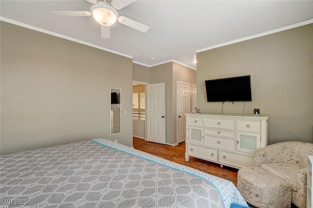 bedroom with ceiling fan, wood-type flooring, and ornamental molding