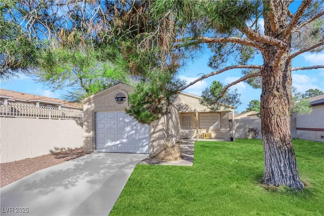 view of front of home with a front lawn and a garage