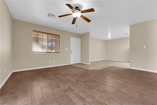 spare room featuring ceiling fan and wood-type flooring