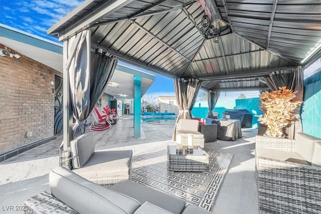 view of patio / terrace with an outdoor hangout area, a gazebo, and grilling area