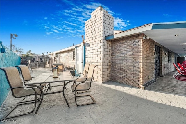 view of patio / terrace with a gate and fence