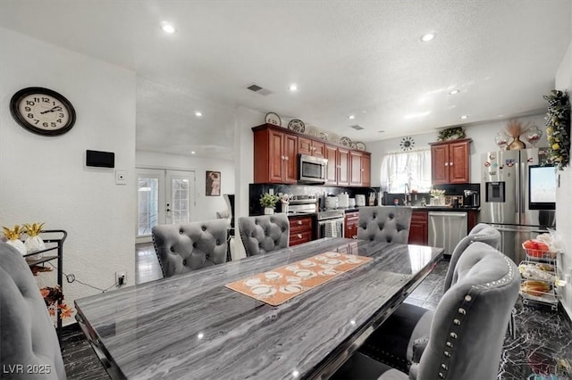 dining area featuring recessed lighting, visible vents, and french doors