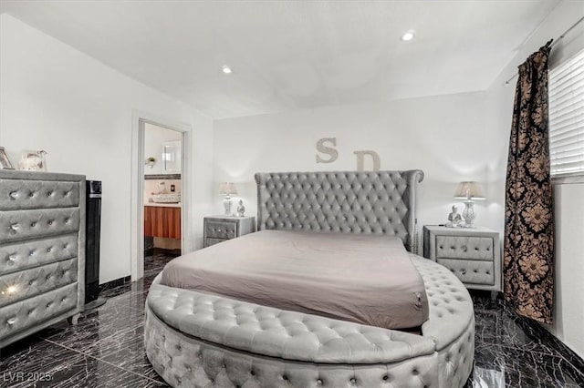 bedroom featuring recessed lighting, marble finish floor, and connected bathroom