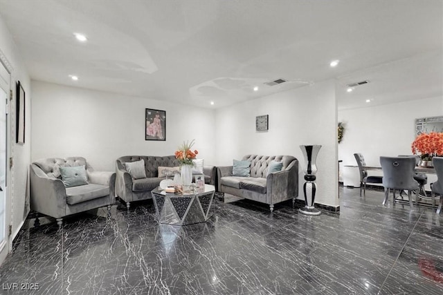 living area featuring recessed lighting, marble finish floor, and visible vents