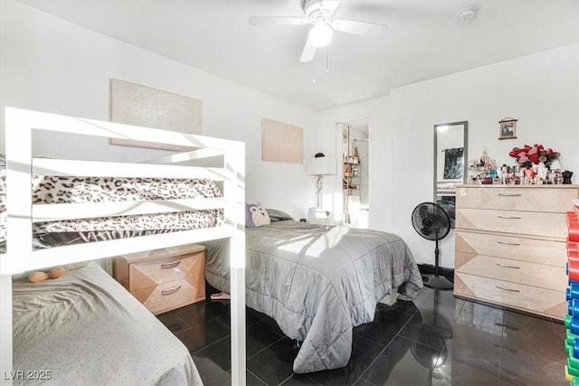 bedroom featuring dark tile patterned flooring and ceiling fan