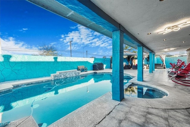 view of swimming pool featuring a patio area, a fenced backyard, and a fenced in pool