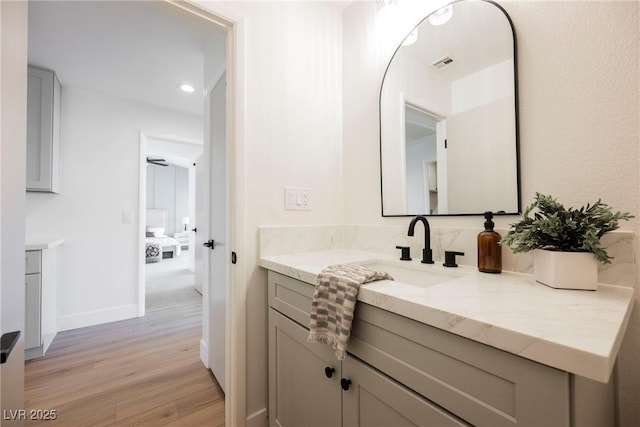 bathroom featuring vanity and wood-type flooring