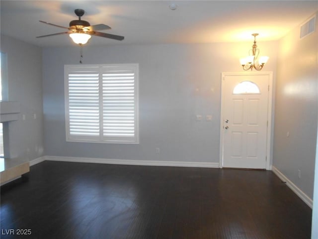 entryway featuring ceiling fan with notable chandelier and dark hardwood / wood-style floors