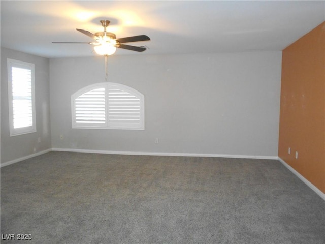 carpeted spare room with ceiling fan