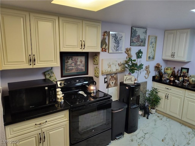 kitchen with cream cabinetry and black appliances