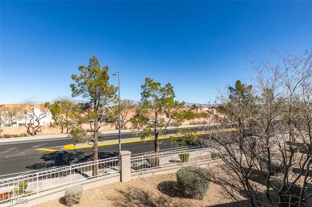 view of home's community with fence