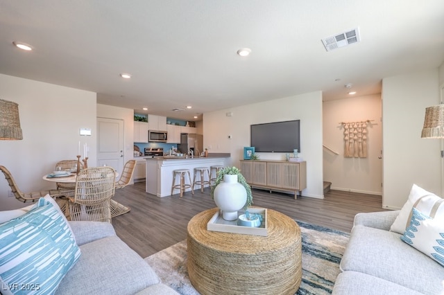 living room featuring dark hardwood / wood-style floors