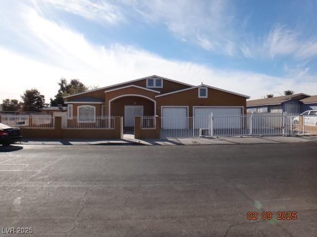 ranch-style house with a fenced front yard