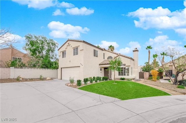 mediterranean / spanish-style home with a garage and a front yard