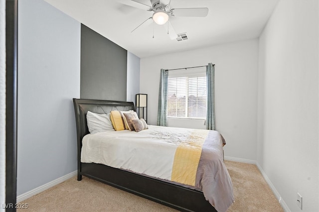 bedroom with light carpet, baseboards, visible vents, and ceiling fan