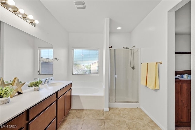 full bathroom featuring a stall shower, visible vents, a bath, and tile patterned floors