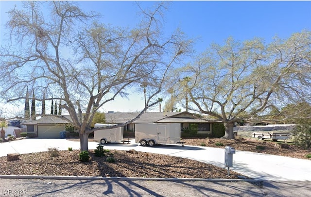 ranch-style home featuring a garage