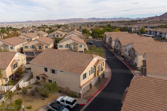 birds eye view of property with a mountain view