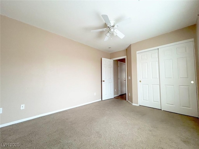 unfurnished bedroom featuring carpet, a closet, and ceiling fan