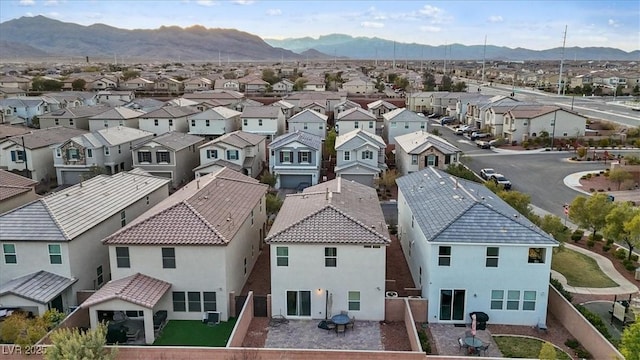 birds eye view of property with a mountain view