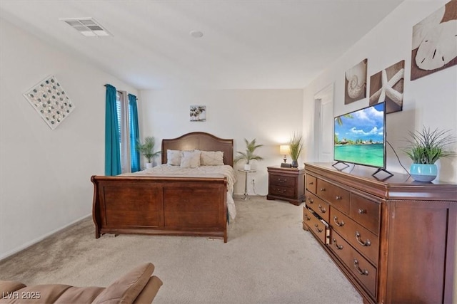 bedroom with light colored carpet