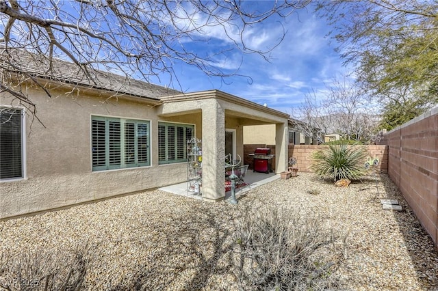 back of property featuring a patio