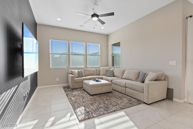 living room featuring ceiling fan and light tile patterned floors