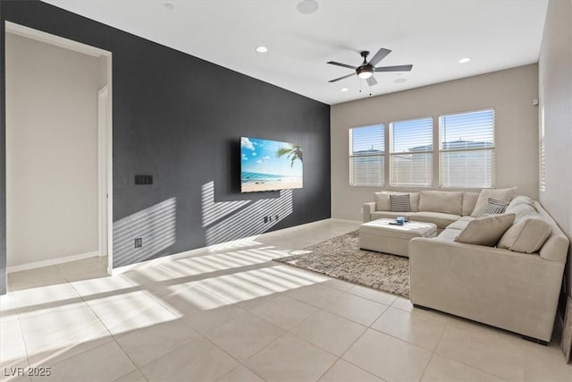 tiled living room with ceiling fan