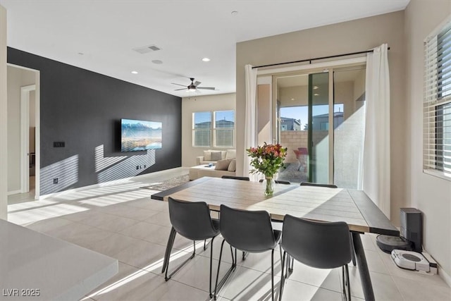 dining room featuring ceiling fan and light tile patterned floors