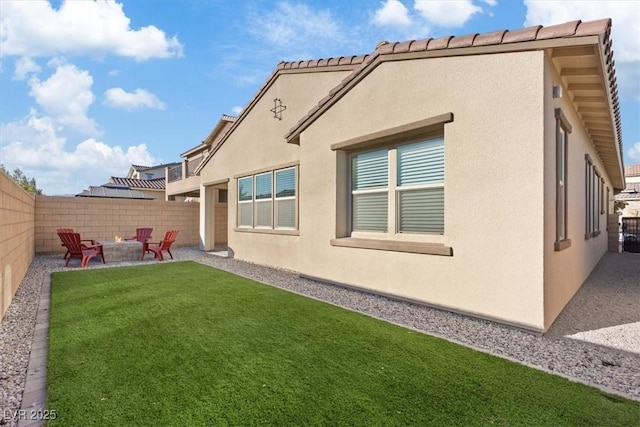 exterior space with a patio area and a fire pit