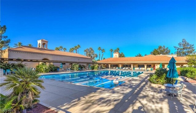 pool with a patio area