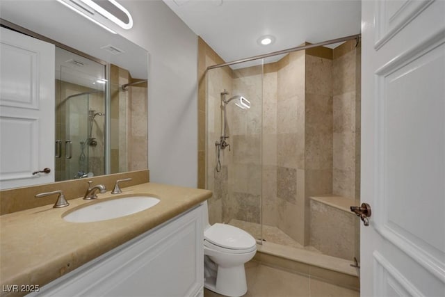 9103 Alta Dr Unit 404, Las Vegas, NV 89145 - bathroom featuring vanity, visible vents, toilet, a stall shower, and tile patterned floors
