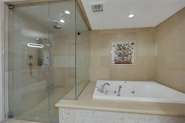 9103 Alta Dr Unit 404, Las Vegas, NV 89145 - full bathroom with a stall shower, a tub with jets, visible vents, and recessed lighting
