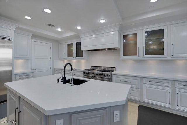 9103 Alta Dr Unit 404, Las Vegas, NV 89145 - kitchen featuring visible vents, a sink, light countertops, high end appliances, and custom range hood