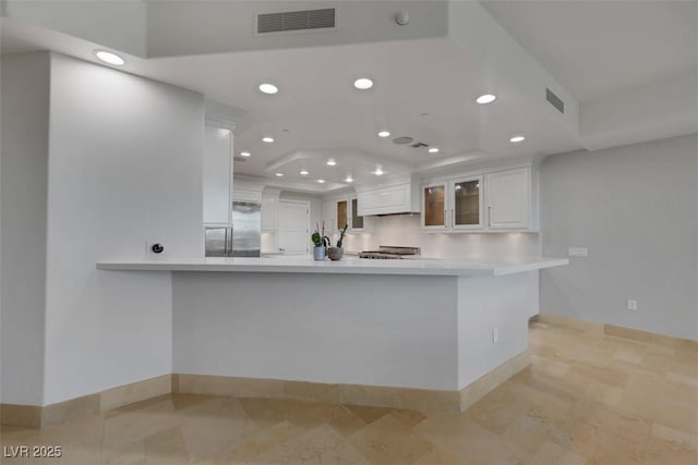 9103 Alta Dr Unit 404, Las Vegas, NV 89145 - kitchen with white cabinets, glass insert cabinets, visible vents, and recessed lighting