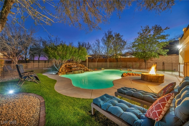 pool at dusk with a patio area, a fenced backyard, a fire pit, and a fenced in pool