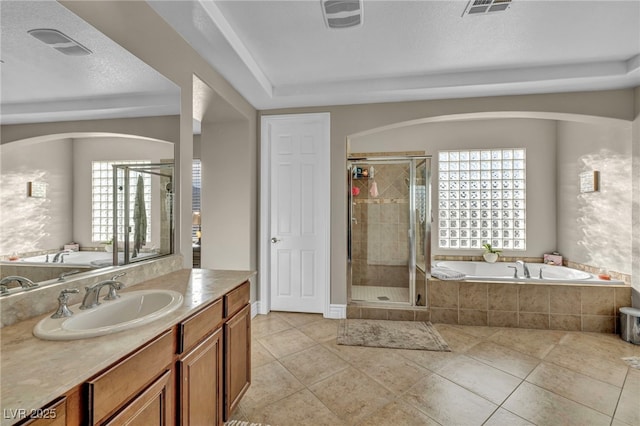 full bath featuring visible vents, tile patterned flooring, a textured ceiling, vanity, and a bath