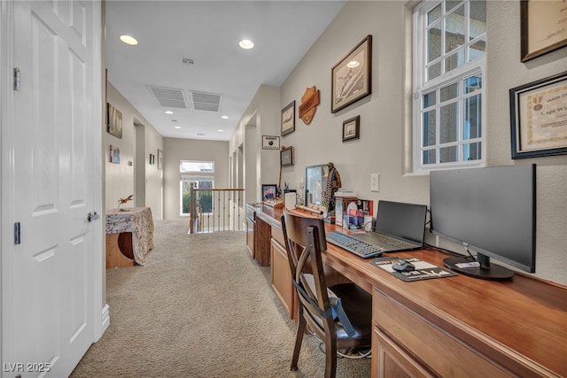 office space with recessed lighting, visible vents, and light colored carpet