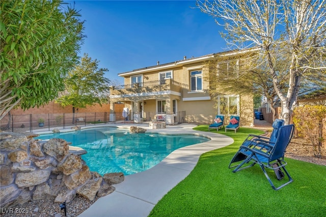 view of swimming pool with a fenced in pool, a yard, fence, and a patio