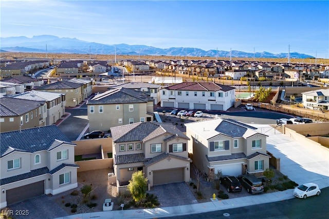 birds eye view of property with a mountain view