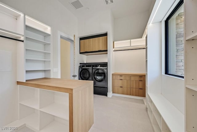 kitchen with washer and clothes dryer, butcher block counters, and built in shelves