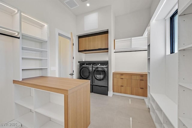 kitchen featuring wood counters and independent washer and dryer