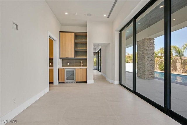 interior space with sink and beverage cooler