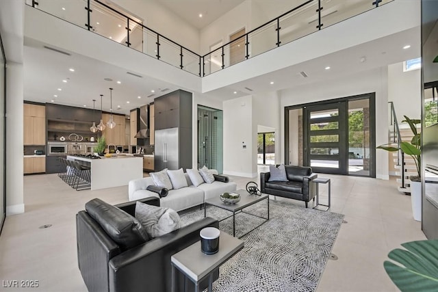 living room featuring a towering ceiling