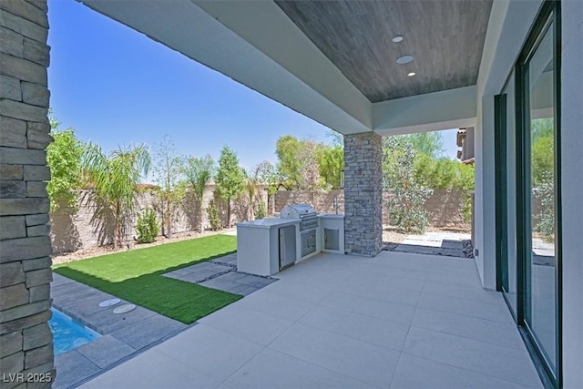 view of patio with a grill and exterior kitchen