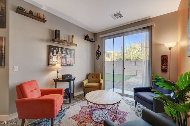 sitting room with hardwood / wood-style floors