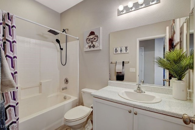 full bathroom featuring shower / tub combination, vanity, and toilet